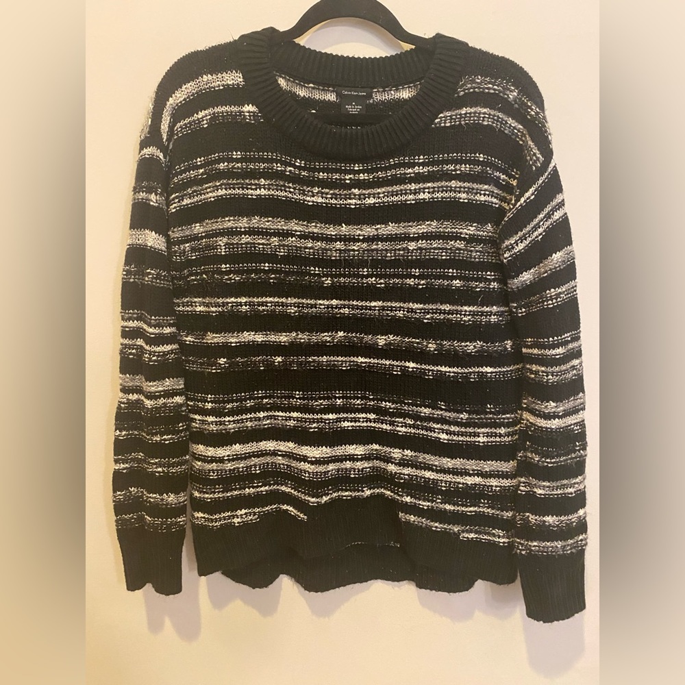 M. CALVIN KLEIN. Black and white sweater.